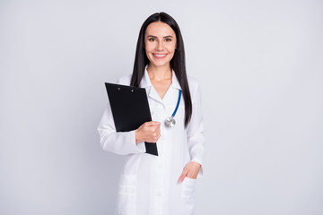 Poster - Photo of beautiful cheerful professional practitioner intern lady good mood hold patient papers medical prescriptions wear white lab coat stethoscope isolated grey color background