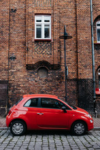 Red Car Fiat 500 On The Bricks Wall