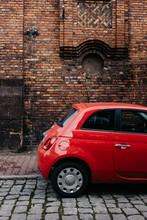 Red Car Fiat 500 On The Bricks Wall