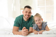 © New Africa - Dad and daughter spending time together at home. Happy Father's Day
