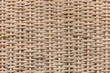Beige wicker basket texture background, abstract symmetric repeating wavy pattern, handmade