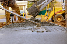 Worker Working For Concrete Pavement For Ground Construction