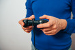 © aeroking - Man playing on the joystick in a game console