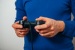 © aeroking - Man playing on the joystick in a game console
