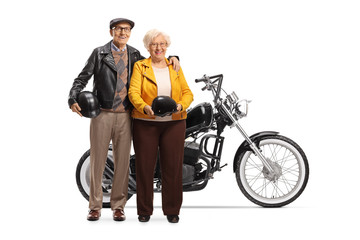 Poster - Senior couple standing next to a custom made chopper motorbike