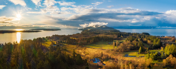 Wall Mural - Aerial Sunrise Panorama of Lummi island, Washington. A beautiful springtime morning seen from above Lummi Island located in the Salish Sea near the city of Bellingham in Whatcom County.