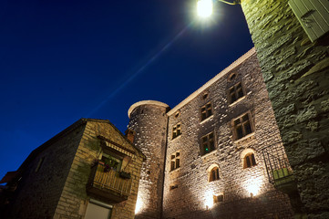 Wall Mural - Towers of medieval stone castle  at night in Vogue in France.