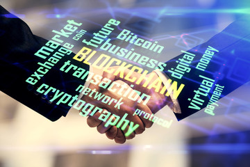 Double exposure of blockchain hologram and handshake of two men. Crypto business concept.