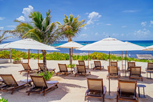 Empty Beach Chairs And Umbrellas In Cancun, Mexico