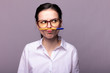 © Диана Шиловская - girl in a white shirt and glasses holds a pen with her mouth