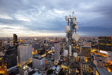 Telecommunication Tower With 5G Cellular Network Antenna On Night City Background
