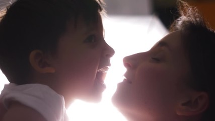 mother and son in white t-shirts on a white background