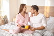 © Pixel-Shot - Morning of young couple having breakfast in bed