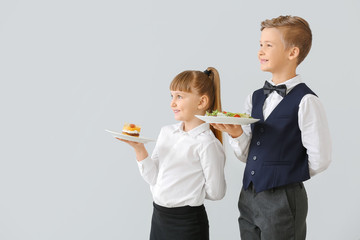 Poster - Cute little waiters on light background