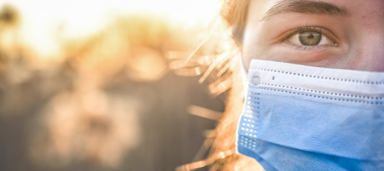 Woman wearing protective mask against coronavirus. Put mask to fight against Corona virus. COVID-19 SARS, SARS-CoV, virus 2020 chinese virus 2019-nCoV