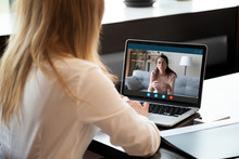 Young Girl Student Woman Holding Educational Video Call With Teacher On Computer, Learning Foreign Language Online From Home, Using Videoconference Application, Chat Communicate Distantly With Friend.