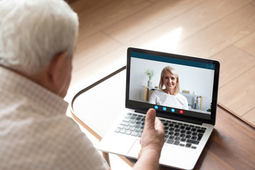 Screen view happy pretty middle aged woman talking speaking chatting with older father husband, enjoying pleasant conversation online via computer video call, e-dating distant communication concept.