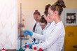 © Vladimir Borovic - Group of  young scientist in laboratory working and learning