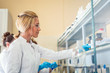 © Vladimir Borovic - Beautiful young woman scientist in laboratory working. Young female scientist doing some research.
