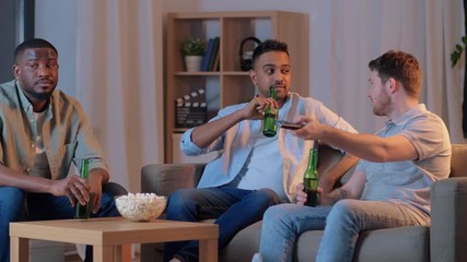 Sticker - friendship, leisure and people concept - happy male friends with beer and popcorn watching tv at home at night