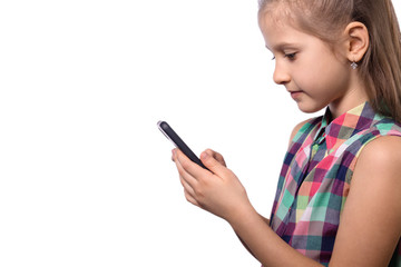 Cute little girl using mobile phone on white background.