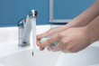 © master1305 - Woman washing hands carefully with soap and sanitizer, close up. Prevention of pneumonia virus spreading, protection against coronavirus pandemia. Hygiene, sanitary, cleanliness, disinfection. Safety.