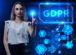 © photon_photo - Business, Technology, Internet and network concept. Young businessman working on a virtual screen of the future and sees the inscription: GDPR