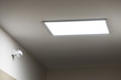 © Alexkarankevich - Large led lighting panel on the ceiling in a modern residential complex. Power saving. Motion sensor. Lighting in non-residential premises and public places. Bright light