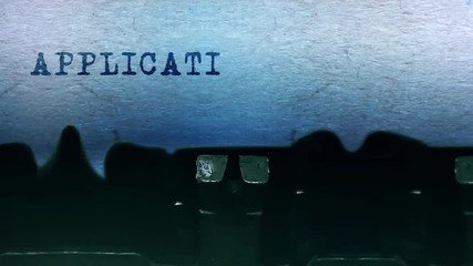 Application Word closeup Being Typing and Centered on a Sheet of paper on old vintage Typewriter mechanical 4k Footage Background Animation.