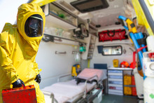  Ambulance And Equipment Views From Inside And Man  In Yellow Protective Hazmat Suit.  Epidemic Virus.