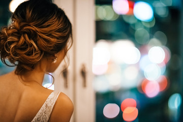 Poster - Shot of a beautiful young bride looking through a window on her wedding day