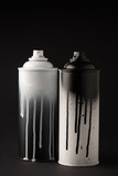 Fototapeta Młodzieżowe - graffiti paint cans on black with copy space
