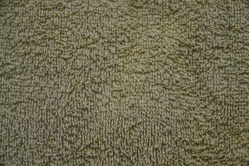 a simple example of a texture of soft, fleecy fabric, a green background.