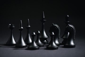 Wall Mural - selective focus of chess figures on black