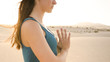 © Glyph_stock - Closeup of young woman meditating in desert. Hands of woman with silver wave ring while practicing yoga.