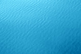 Fototapeta Zachód słońca - blue water background texture of sea surface top down view Natural color of ocean aqua with waves Backdrop for design