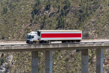 Wall Mural - Bloukrans Bridge, Eastern Cape, South Africa. Dec 2019. Bloukraans Bridge carrying a toll road 216 metres above the gorge. A grocery store delivery  truck passes over the bridge