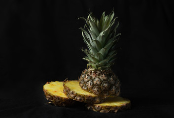 ripe pineapple on a black background