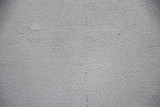 Fototapeta Desenie - White-gray grungy wall background. gray-white surface