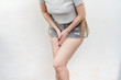 © Todayphoto - Young woman in a jeans shorts standing with her hands between legs