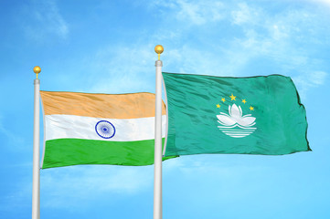 India and Macau two flags on flagpoles and blue cloudy sky