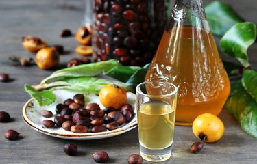 Poster - Liqueur nespolino. Loquat seed liquor. tincture alcoholic on bones loquat . Amaretto with almond flavor. recipe for medlar. alcoholic beverage from the  loquat. tincture on seed loquat. 