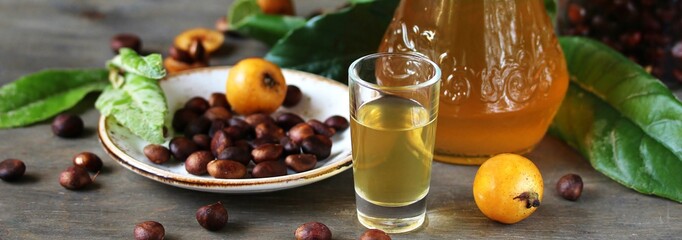 Poster - Liqueur nespolino. Loquat seed liquor. tincture alcoholic on bones loquat . Amaretto with almond flavor. recipe for medlar. alcoholic beverage from the  loquat. tincture on seed loquat. 