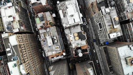 Wall Mural - Aerial view of New York downtown building roofs. Bird's eye view from helicopter of cityscape metropolis infrastructure, traffic cars moving on city streets and district avenues