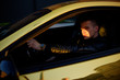 © MoreThanProd - A man driving an expensive car. A man is driving, a successful man is driving a car. Golden yellow car. A man at sunset driving. Success, expensive, freelance, businessman, famous.