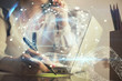 © peshkova - Double exposure of woman hands typing on computer and social network theme hologram drawing. People media concept.