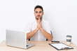 © luismolinero - Young business man with a mobile phone in a workplace pleading