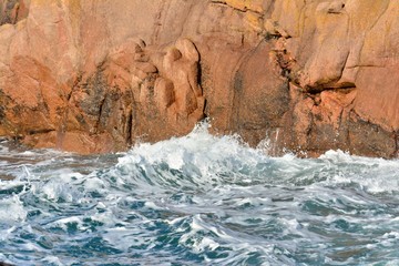 Beautiful view of the pink granite coast during storm in Brittany. France