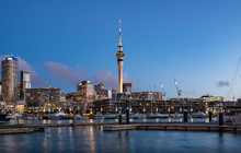 Twilight View Of Sky Tower View From Viaduct Harbour In The Central Of Auckland, New Zealand. Auckland Is New Zealand's Largest City And The Centre Of The Country's Retail And Commercial Activities.