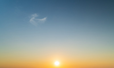 Wall Mural - abstract amazing scene of stuning colorful sunset with moving clouds background in nature and travel